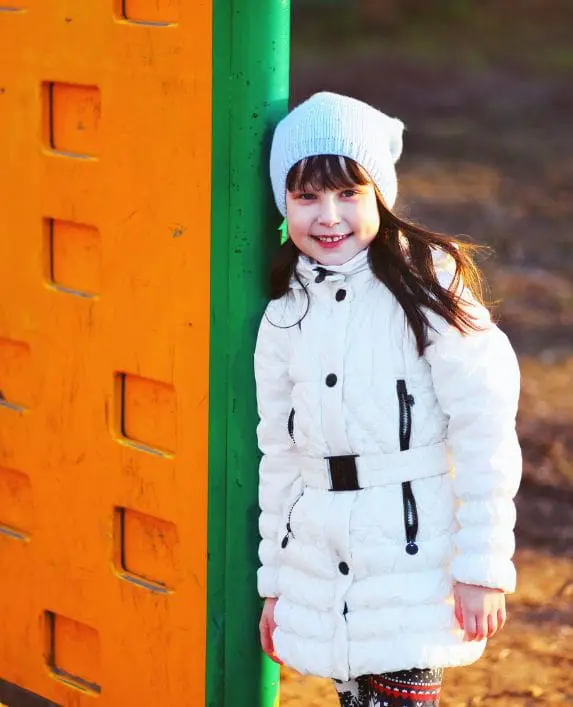 Girl standing in a playground