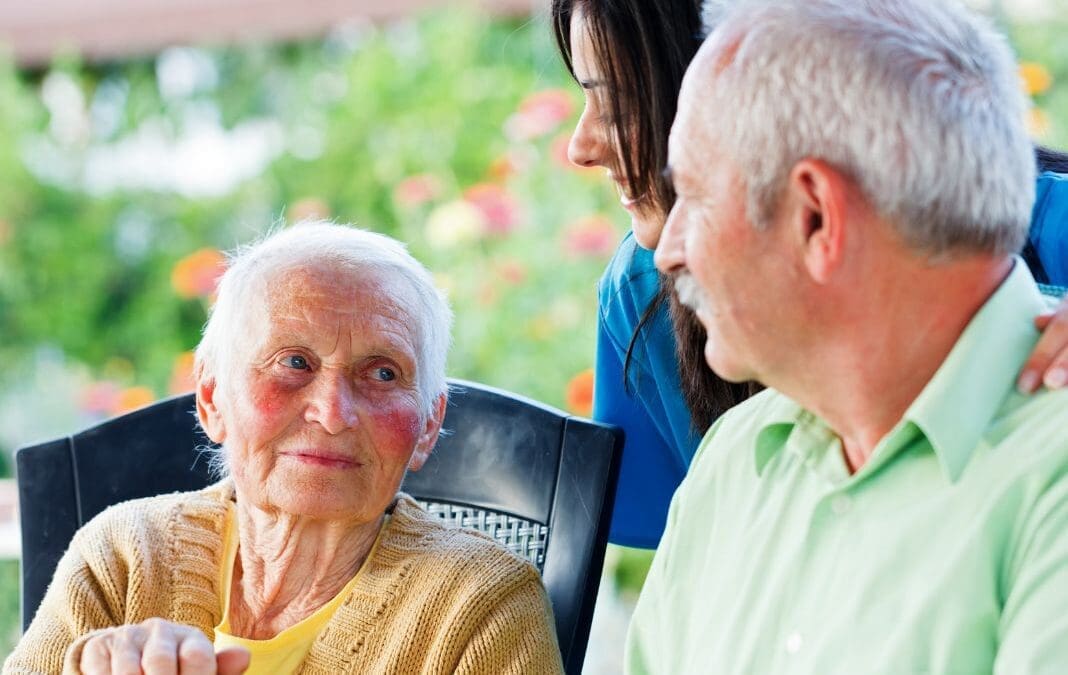 Older lady with a family member and a nurse.