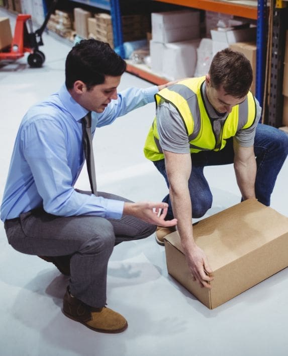 Man trying to lift a box