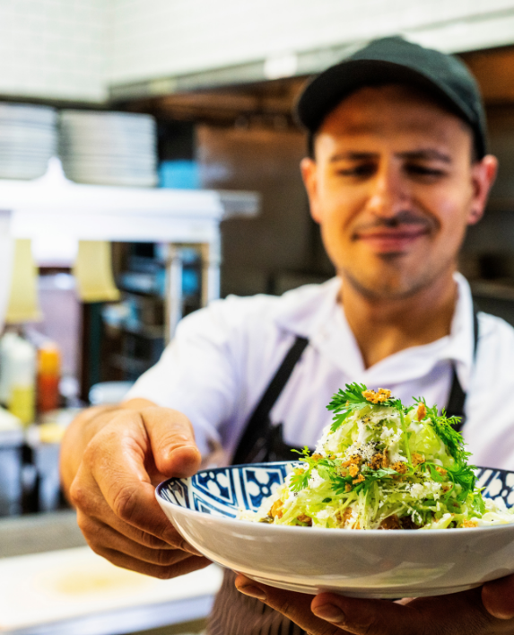 Chef preparing food for a cafe