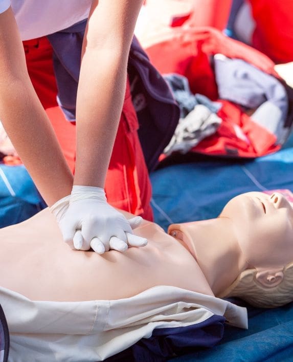 Somebody practicing CPR on a dummy