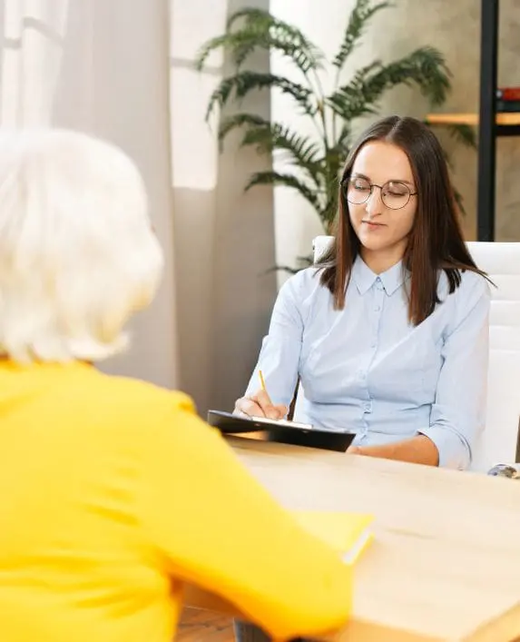 Lady being intervied by another lady