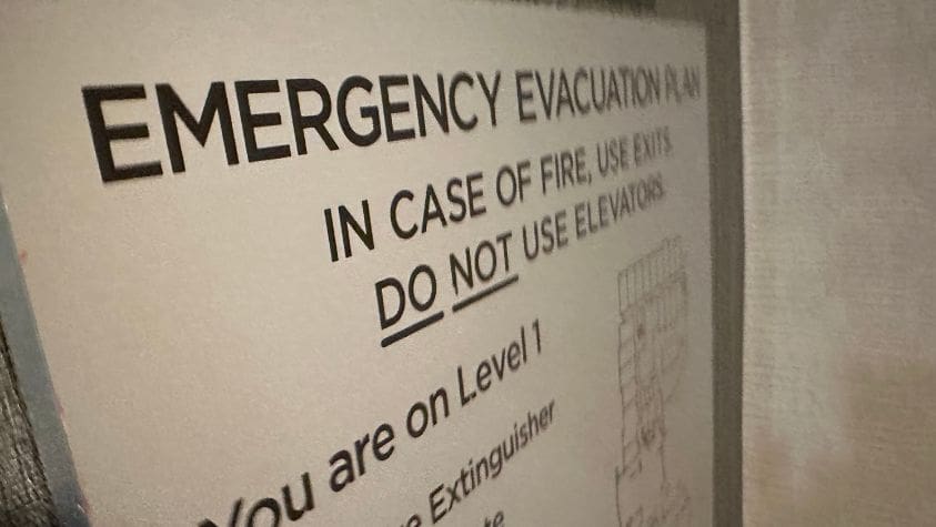 Sign with emergency evacuation procedures.
