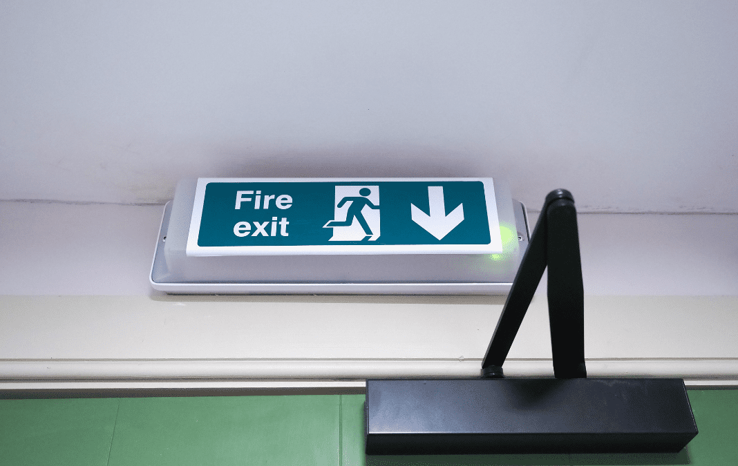 An image which shows the sign for a fire exit.
